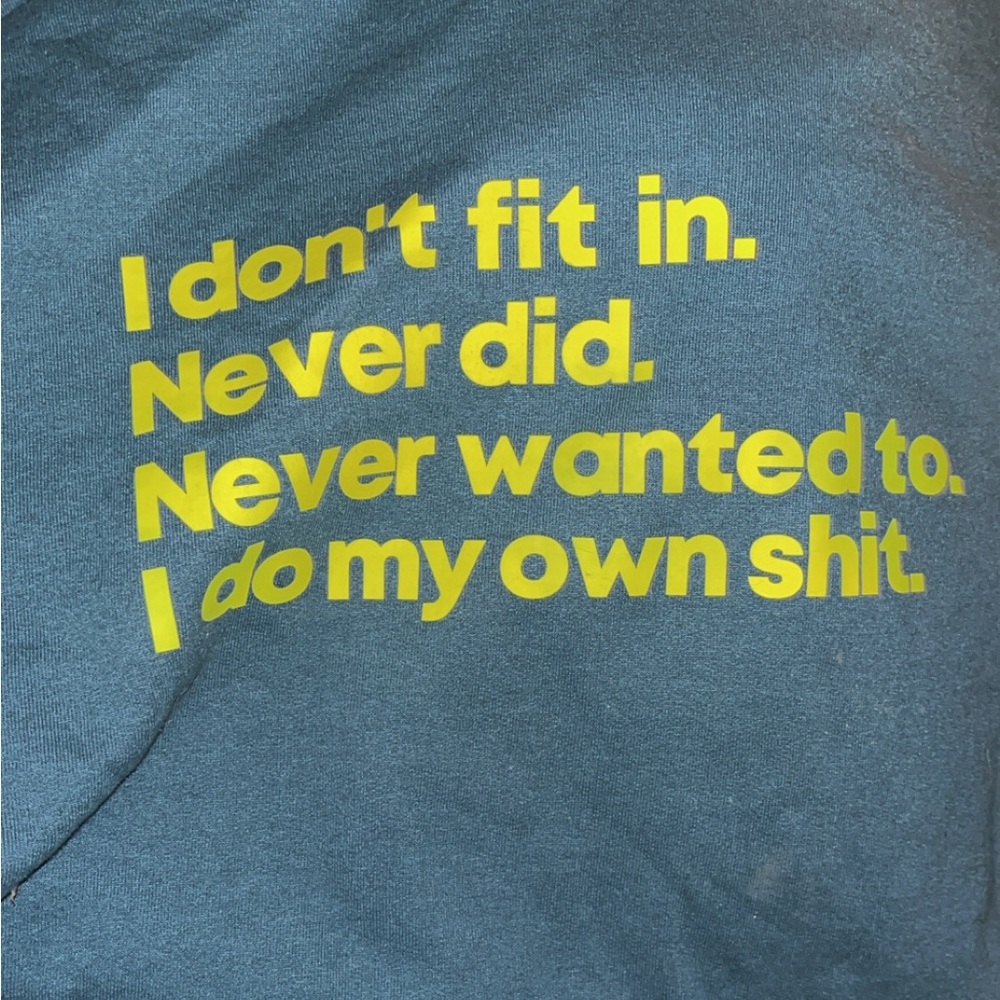 Dark teal hoodie with Neon writing